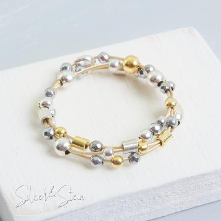 Geflochtener biegsamer Gold-Ring mit Silber und grauem Hämatin
